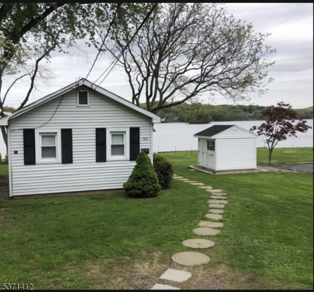 LAKEFRONT, LAKEFRONT, LAKEFRONT. Enjoy the amazing views all year long from this quaint lakefront cottage. Enjoy privacy of the single family structure, with a private yard .Tenant responsible for snow removal up to 3 inches, anything more the landlord will take care of. Enjoy the close proximity of the train station, bus stops, shopping, Rt 206, Rt 46, Rt 80 and Rt 10. 8 x 8 shed available to tenant for storage. See documents for lease obligations to be added to lease. Park on left side of driveway only. No pets allowed.
