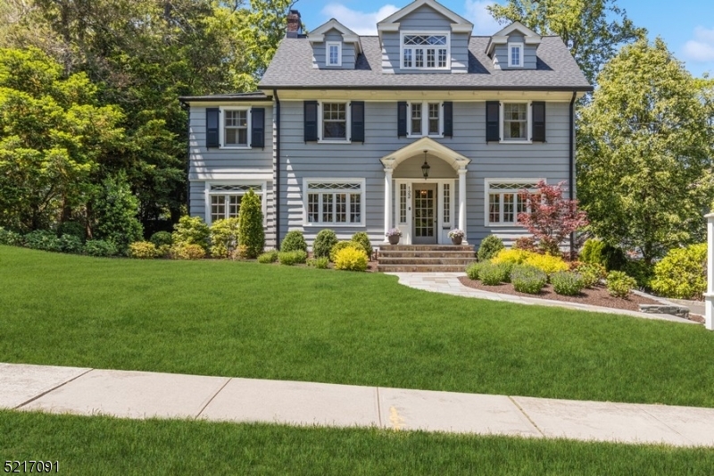This Northside colonial is moments from town. Located in Summit's finest neighborhood, this desirable home has everything. Four floors of useable living space create a wonderful setting for entertaining and private outdoor living. From the balcony off the primary bedroom to the built in gas fire pit on the bluestone patio, there's nothing more to do but move in and relax. The private and lush backyard is accessed easily from the lower level and first floor.  The unique oversized porch with beautiful mahogany floors, overlooks the backyard. This particular property is an opportunity not to be missed.
