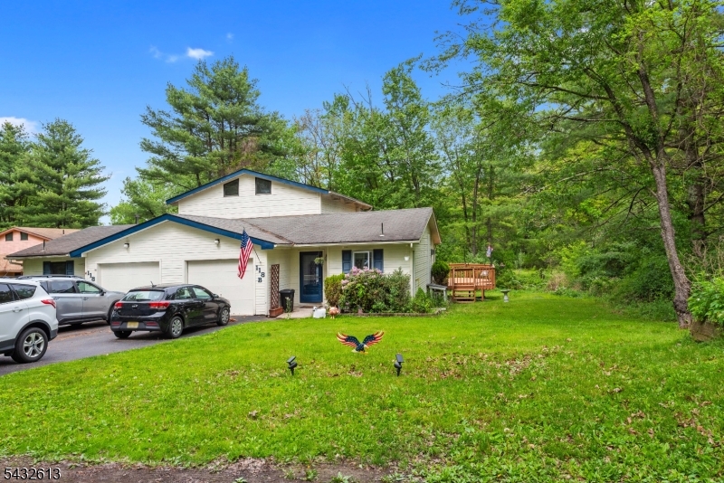 Located on a peaceful cul-de-sac, this well- cared-for 2-bedroom, 2-full-bath half duplex in High Point Country Club has it all! This rarely offered model features a ground-level garage, offering exceptional ease and direct access to the main level of the home. Inside feels bright and welcoming, with soaring beamed ceilings in the living room that create an airy atmosphere and distinctive charm. For enhanced comfort throughout the seasons, the home includes a freestanding propane stove and a split-unit heating and cooling system. The updated kitchen is both practical and tasteful, featuring quartz-inspired countertops and a ceramic tile backsplash. Both bathrooms have been thoughtfully refreshed, adding to the home's polished appeal. Newer sliding glass doors (and newer windows) add natural sunlight and lead you outside to the EXPANSIVE deck, where the wooded natural setting creates a tranquil and secluded outdoor retreat. Amenities include lake access, pool, tennis and basketball court, and playground. Also within the Community is the High Point Country Club 18-HOLE PUBLIC GOLF COURSE! Loads of outdoor recreation nearby with High Point Monument State Park, the Appalachian Trail, Delaware River Rafting, and local Ski Resorts.  All room sizes are approximate.  Why rent when you can own?