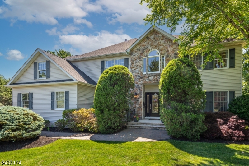 Your dream home awaits! This immaculate Colonial sits on a cul-de-sac in one of Randolph's finest neighborhoods. With 4 bedrooms, 4.5 baths, a finished basement and a 3 car garage, there is room for everyone and everything. Enter the dramatic 2 story foyer with charming staircase, hardwood floors and open concept floor plan. At the heart of the home, the chef's kitchen anchors the main level with quality cabinetry, granite counters, center island, double oven, pantry and sliders to a deck featuring a built in outdoor island with grill, refrigerator and sink. Below the deck, a patio with a fire pit. The formal living and dining rooms flow together through French doors. The great room with its dramatic two story ceiling and fireplace opens to the family room, creating an expansive living space. The first floor offers a den with a full bath, ideal for guests or extended living. Upstairs, the primary suite boasts a tray ceiling, massive walk-in closet and luxury bath with separate tub and shower. Three additional bedrooms include one with a huge walk-in closet, a princess suite with its own private bath and a third overlooking the backyard. The finished walkout basement showcases a rec room, media room, exercise room, bonus room, kitchenette and powder room. The generous flat yard offers privacy for play, gardening, or simply unwinding. Close to shopping, restaurants, parks & Randolph trails. Imagine the lifestyle you will create here & the lifetime of memories you will make.