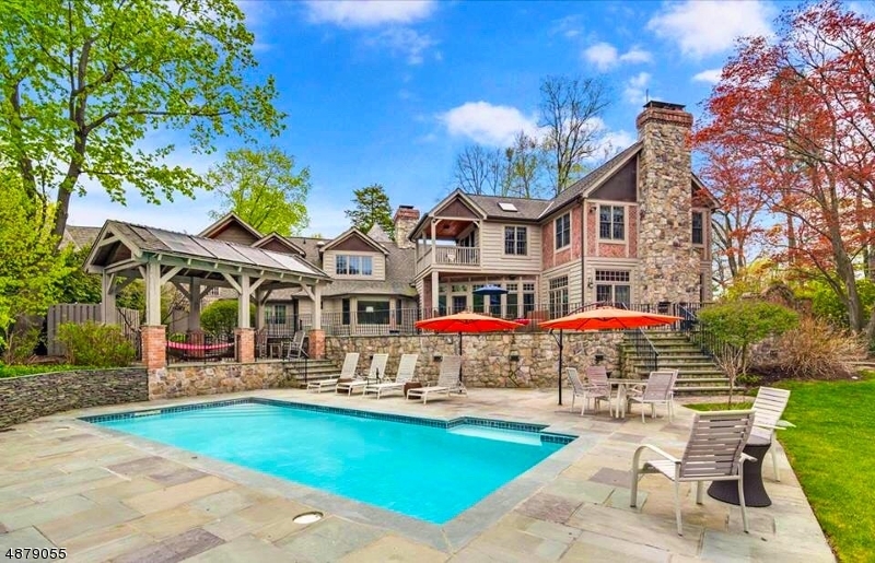 Cross the bridge and enter into another world.  Custom built luxury home located in the highly desirable Lake Mohawk community is less than 50 miles outside of Manhattan. Taxes are now $50,251 Amenities include stunning original log cabin walls, vaulted ceilings, walk-out chef's kitchen with stainless steel cabinets, 1500 sq ft office on second floor with full bath and separate entrance, oversized two-car garage, fully furnished basement, including a gym, walk-in shower & steam room, & 500 bottle wine cellar. The truly gorgeous backyard is your own private retreat, perfect for entertaining and events, and includes a stone patio, deck, gazebo, garden, beautiful in-ground solar-heated outdoor pool, outdoor fireplace, outdoor lighting, and lake-fed irrigation system. The ultimate luxury lake lifestyle