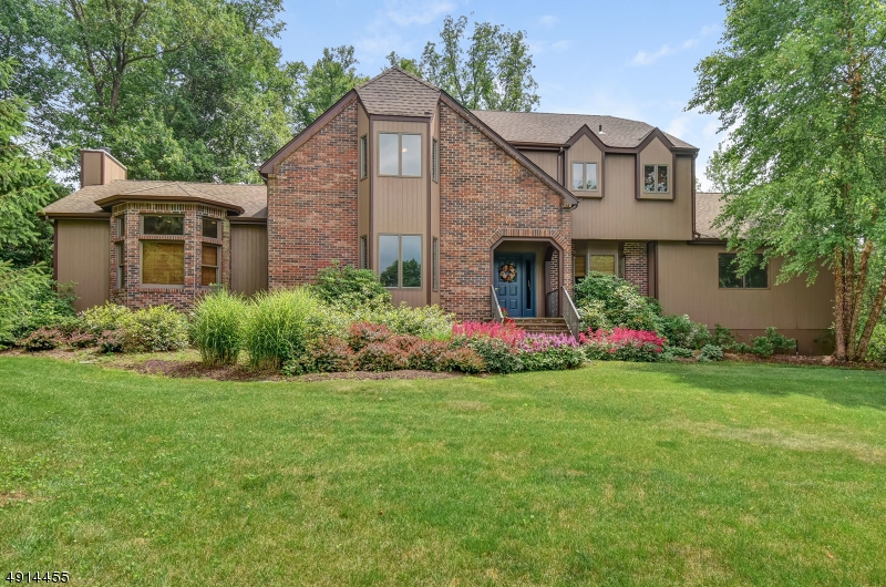 Nestled among tall trees on a quiet cul-de-sac, this stunning Colonial is certain to catch your attention. Step into the large foyer, flanked by spacious rooms. Entertain guests in the living room, or host your next dinner party in the formal dining room. Hardwood floors and French doors lead you from one inviting area to the next. The kitchen has ample cabinet and counter space, The separate breakfast area offers fantastic views of the backyard. Four bedrooms provide restful sleep at the end of busy days. The master suite features a massive walk-in closet and private master bath with jetted soaking tub. Outside, the backyard oasis awaits. The deck and patio are made for entertaining, and the heated in-ground pool is perfect for summer fun. The fenced backyard welcomes active play and gardening.