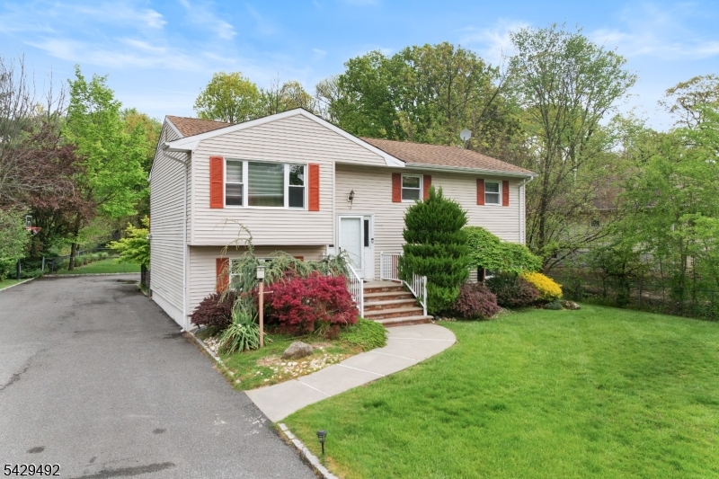 Welcome to 13 Fishel Road, a spacious and inviting home nestled in one of Edison's most sought-after neighborhoods. Perfectly suited for a family, this property offers an abundance of living space both inside and out. The home features a versatile layout with a walkout lower level, providing additional living or entertainment space with easy access to the outdoors. An oversized garage offers ample room for parking, storage, or a workshop setup. Step outside to a generously sized backyard ideal for gatherings, play, or simply relaxing in your own private retreat. Whether hosting summer barbecues or enjoying quiet evenings, this outdoor space delivers endless possibilities.  Located within a highly regarded school district, this home combines comfort, convenience, and community appeal. With its desirable location and room to grow, 13 Fishel Road is a fantastic opportunity to put down roots in North Edison.
