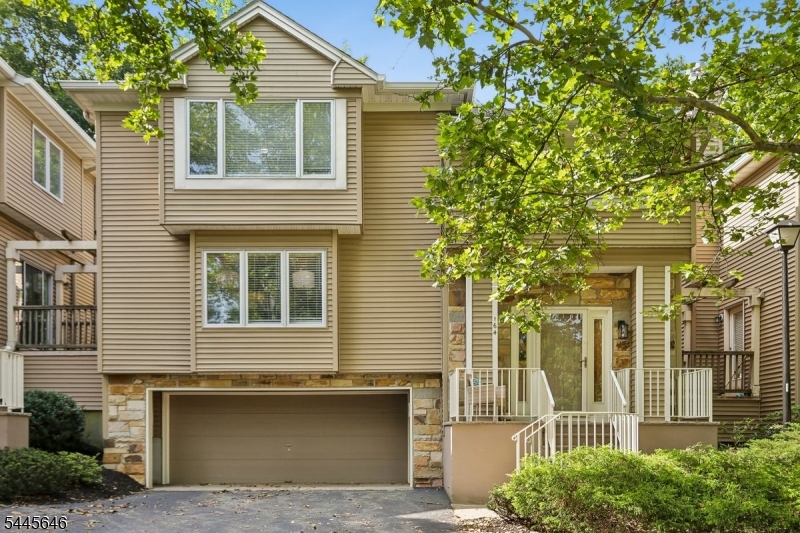 Well maintained, thoughtfully updated, and move-in ready, this freshly painted townhouse offers the perfect blend of comfort, style, and low-maintenance living. Soft, contemporary colors complement the open-concept living and dining area, which flows seamlessly into the updated kitchen, adjoining family room, and private rear deck ideal for entertaining or relaxing while enjoying a connection to nature.The heart of the home is the updated kitchen featuring a movable center island, stainless steel appliances, new quartz countertops, and modern lighting. The adjoining family room showcases custom floor-to-ceiling built-ins, providing abundant display space for books, artwork, and treasured keepsakes.Upstairs, the spacious primary suite offers a sitting area, walk-in closet, and private en-suite bath. A generously sized second bedroom, full hall bath, and convenient second-floor laundry complete the level.The finished lower level provides flexible space for a home office, media room, fitness area, or quiet retreat. Direct interior access to the oversized two-car garage adds exceptional storage and everyday convenience.Offering the privacy of a single-family home with the ease of condominium living, this beautifully maintained residence is ready for immediate enjoyment. Simply unpack and start enjoying a lifestyle of comfort, convenience, and tranquility from day one.