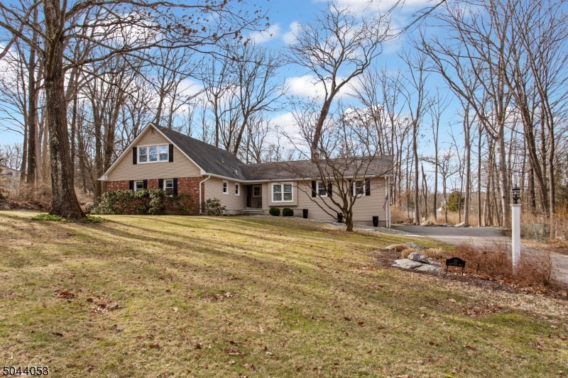 Wonderful expanded 5 bedroom ranch on 3/4 acre at end of cul de sac.  Super neighborhood & steps away from elementary school and park.  Extensive renovations to interior has created an open floor plan 2.5 baths; Renovated spa like 1st flr bath, hardwd flrs, slate fplc, new hot water heater, furnace with 5 zones & central air.  House generator installed w/direct to gas line 2018.  Backyard features 12x20 deck w/separate 12x16 screened in porch with shiplap vaulted ceiling & chandelier.  Delightful on a summer night!  Over the 2 car garage is 16x22 stand up attic w/workbench.  Full basement 28x42 w/workbench partially finished w/walk out door.  An upgrade list is available.  Mountain Lakes High Schl. Annual fee $25 for lawn care of street entrance. Its your turn to enjoy this beautiful & well maintained home.