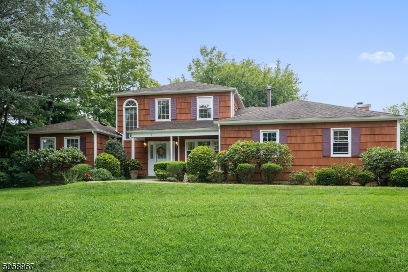 Welcome the house you have been waiting for! Custom home with open layout on cul de sac street in Whippany is here!!  First floor features: impressive two story foyer; living room; formal dining room; open kitchen with breakfast bar, stainless steel appliances and granite counter tops; family room w/wood burning fire place opening to a large deck; powder room; master bedroom w/dressing area, walk-in closet, full bath w/double sinks; laundry room.  Second floor offers 3 bedrooms or 2 bedrooms and an office. full bath.  There are hardwood floors through out 1st and 2nd floors.  Large, partially finished basement provides additional entertainment area, office,  plenty of storage!!   Landscaped, beautiful yard & two car garage complete the picture of perfection.  Welcome home!!
