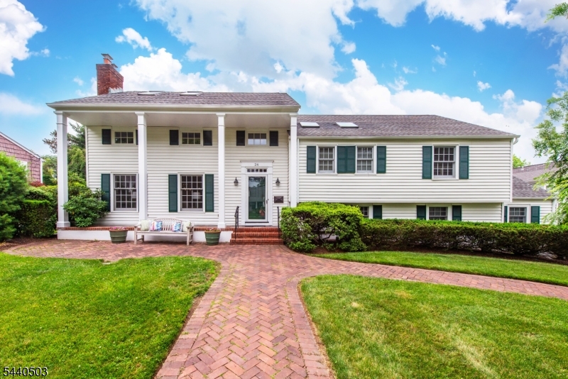 The formal columned, beautifully maintained exterior of this colonial home belies the comfortable lifestyle that awaits within. The mid-century modern floor plan adapts to every lifestyle....open floor plan but private spaces. A spacious entry foyer with guest closet opens to a living room with fireplace& book shelves. Two lovely clamshell builtins enhance the dining room, perfect for displaying some of art or other precious decor. Adjacent to the dining room is a 3 season porch. An updated eat-in kitchen adjoins both. Then a few steps down to a family room with sliders to the yard. Nearby powder room, laundry room, garage entrance & basement entrance complete that level..Bonus!! Drive into your attached garage on rainy or snowy days. A few steps up from the entry way find private space. Primary bedroom has newly renovated bath & loads of closets. Double sized bedroom & hall bath afford ample flexible space. Then a few steps to 2 additional bedooms/office & bath on 3rd level. Entrance to the attic is also on that level. Between the basement & attic, there's no need to rent those ubiquitous storage units for luggage or holiday decor. Situated on a landscaped lot, close to two parks, this is a perfect place to land. Flexible living from formal to casual. Idyllic, quiet location...close to Yantacaw Brook park.