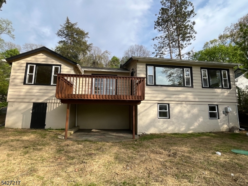 Lakeview Retreat in Desirable Sparta Lake Community!Charming 3-bedroom, 1-bath ranch offering seasonal lake views, character-filled interiors, and a peaceful setting surrounded by nature. This unique home features warm wood accents, exposed beam vaulted ceilings, hardwood floors, stone detailing, and large picture windows that bring in abundant natural light and showcase the scenic surroundings.The spacious living area with panoramic views, while French doors open to an elevated deck overlooking the private backyard and wooded landscape. Enjoy the beauty of lake living with nearby access to the community lake, perfect for kayaking, fishing, swimming, or relaxing year-round.Additional highlights include a newer septic system, updated windows, fresh exterior paint, lower-level storage space, and off-street parking. Nestled on a quiet hillside lot in one of Sparta?s sought-after lake communities, this home offers a rare opportunity to enjoy privacy, charm, and nature just minutes from town, shopping, dining, and commuter routes.Perfect as a full-time residence, weekend getaway, or investment opportunity!