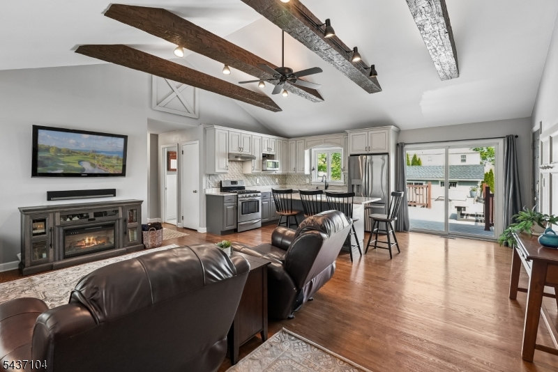 Stunning renovated three-bedroom, one-and-a-half bath ranch on a quiet street in convenient  Bridgewater. All of the expensive updates are done:  kitchen (2018) , baths (2022 & 2026), siding (2026), roof (2010 & 2020) , gutters( 2020),  HVAC (2019), and much more. Cathedral ceiling open floor plan with a granite island kitchen opening to an expansive Trex deck overlooking beautiful backyard fenced for pets or play. The perfect place for work-from-home with a bedroom/office set-up with a Murphy bed - and the perfect place for relaxation with a gas-fueled fire pit off the deck. Covered patio to take a break in the shade when done puttering in the nearby raised-bed vegetable garden.  Full basement walks up to attached garage with an extra-wide blacktop driveway plus parking for one more vehicle on driveway behind the fence.  Nationally-recognized Bridgewater Township School District. A mile to NJ Transit trains and easy access to commuter routes 202/206, 287, 22. Minutes to schools, shopping (Trader Joe's, Costco, Home Depot, Target, Whole Foods) and a wide array of restaurant, entertainment, and recreation opportunities.