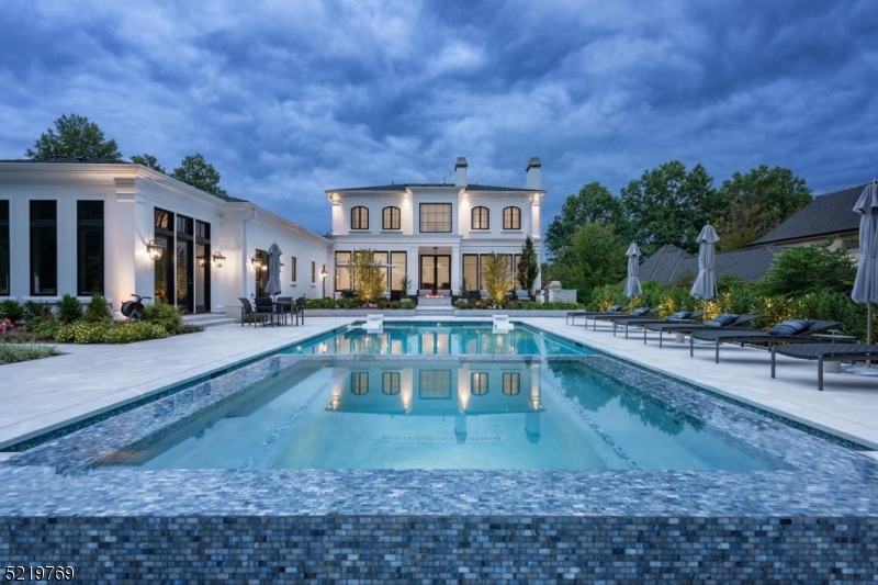 This stunning gem was masterfully crafted in 2018 by architect Rosen Kelly Conway, boasting an impressive 6/7 bedrooms and 7.2 lavish baths with radiant heated floors all sprawled across almost an acre of private property. Every inch of this home is adorned with exquisite custom features, including Lutron lighting and shades uses control4.  A spectacular soundproof home theater with state of the art technology,Meridian surround sound digital and audio. You'll be enamored by the grandeur of the 10 and 11-foot ceilings throughout, adding a sense of spaciousness, imported french oak flooring, The magnificent gourmet chef's kitchen is a culinary dream come true, featuring seamless custom cabinetry done by Heidi Piron, top of the line appliances Wolf 48inch dual fuel double ovens, Sub-zero and Miele. No detail spared. Step outside and immerse yourself in the professionally landscaped front and backyard, resort style outdoor glass fire pit, an 45X20ft pool with 8x8ft serenity spa, sun shelves, LED colored lighting, 1700 sqft Turkish marble pool deck, and a finished and heated cabana with Kitchen & full bath.  This custom transitional timeless home is truly one-of-a-kind, embodying luxury living at its finest. Don't miss your chance to experience the pinnacle of refinement and sophistication in Bel Air.