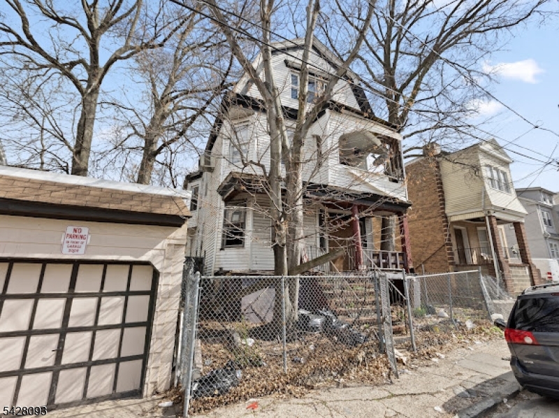 Rare opportunity to acquire an oversized lot in Irvington with significant redevelopment potential. Situated on approximately 0.43 acres, this property is currently improved with an existing multi-family structure in distressed condition, offering an ideal opportunity for renovation, repositioning, or potential new construction (buyer to perform all due diligence).The size and layout of the parcel provide flexibility for a variety of future uses, subject to township approvals and zoning regulations. This is a strong option for investors, builders, or end-users looking to capitalize on land value in an evolving Essex County market. Conveniently located near major roadways, public transportation, shopping, and local amenities.Property is being sold strictly AS-IS. Buyer responsible for all inspections, certifications, and municipal requirements.
