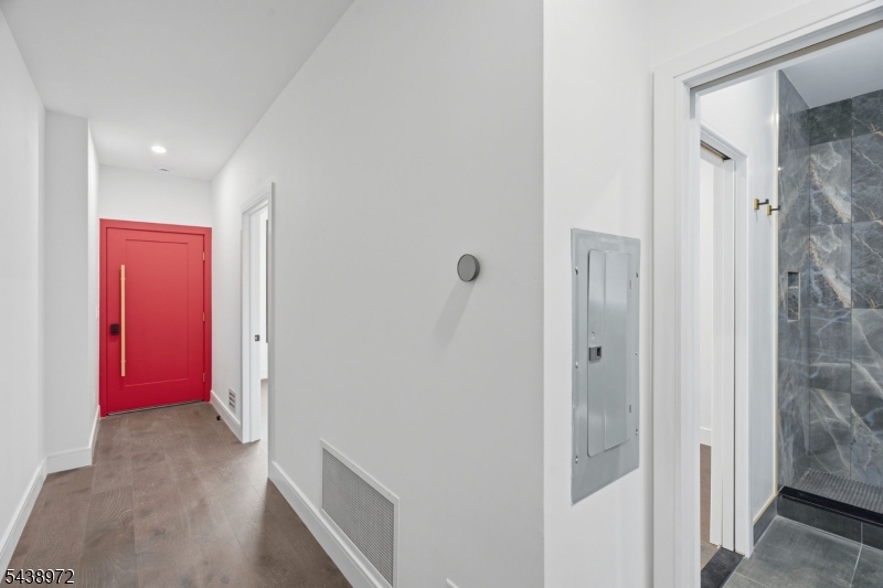 Welcome to 9 Minerva Street, Unit 1 at The Addison, where luxury, craftsmanship, and lasting quality come together in the heart of Bergen Lafayette. Built with cement and steel construction, this exceptional 3 bedroom, 2 bath multi level residence lives more like a townhome than a traditional condo. Soaring ceilings, oversized matte black Marvin windows, custom solid wood doors, designer railings, Raphael porcelain tile, and Panda quartz countertops with a full height backsplash create a truly elevated living experience. The chef's kitchen features premium ZLINE Black Matte Autograph appliances, abundant storage, and opens to a private outdoor space perfect for grilling, entertaining, or relaxing. A spacious bonus flex room offers endless possibilities as a media room, home office, gym, or playroom. The primary suite includes a walk in closet and spa inspired bath. Additional highlights include tankless hot water, in unit laundry, enhanced soundproofing, and superior insulation for year round comfort. Nestled on a quiet no through street just 1.5 blocks from the Garfield Avenue Light Rail, you're moments from Downtown Jersey City, Manhattan, parks, restaurants, and local favorites. Offering Downtown Jersey City and Hoboken quality at nearly half the price per square foot, this is far from average new construction. Experience the design, quality, and value that make The Addison a standout opportunity.