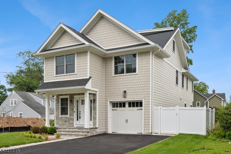 Exceptional new construction by a premier local builder in desirable Madison. . This thoughtfully designed 5-bedroom, 4.5-bath Colonial blends timeless architecture with sophisticated modern living across four finished levels.The sun-filled open floor plan showcases custom millwork, designer finishes, and wide-plank white oak flooring throughout. At the heart of the home is a stunning chef's kitchen featuring custom cabinetry, quartz countertops, an oversized center island, and premium Thermador appliances. The kitchen flows seamlessly into the spacious family room with a gas fireplace and access to a private patio and beautifully landscaped backyard, creating the perfect setting for everyday living and entertaining.The luxurious primary suite offers a vaulted ceiling, spa-inspired bath, and dual custom walk-in closets. Three additional second-floor bedrooms include a private en-suite and a well-appointed hall bath. A convenient second-floor laundry room completes the level.The finished third floor provides flexible space for a home office, gym, media room, or playroom. The fully finished lower level features a recreation room, wet bar, fifth bedroom, full bath, and ample storage, ideal for guests, or entertaining.Located just minutes from downtown Madison, top-rated schools, parks, and Midtown Direct train service, this exceptional home offers the perfect combination of luxury, comfort, and convenience.10 Year New Home Warranty