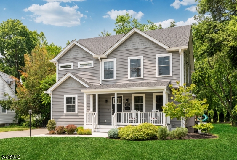 Beautifully built just five years ago, this exceptional Colonial offers modern living in a prime Glen Rock. A welcoming covered porch leads into a light-filled open floor plan designed for today's lifestyle. The comfortable living room with gas fireplace flows seamlessly into the chef's kitchen featuring a large center island, quartz countertops, subway tile backsplash and high-end stainless-steel appliances. Open to the formal dining room with access to the Trex deck, creating the perfect indoor-outdoor entertaining experience. A convenient first-floor bedroom or office sits adjacent to a full bath. Upstairs offers three spacious bedrooms including the luxurious primary suite with a custom walk-in closet and spa-like bath complete with double vanity, glass-enclosed shower and freestanding soaking tub. The finished lower level provides additional living space with a great rec room, half bath storage and systems. Set on nearly one-third acre of beautiful flat property, the backyard offers endless possibilities for enjoyment. Thoughtfully upgraded throughout with premium features including custom window treatments, custom closets, a whole-house generator, reverse osmosis system, air purification and more, this move-in ready home offers comfort, convenience and peace of mind.