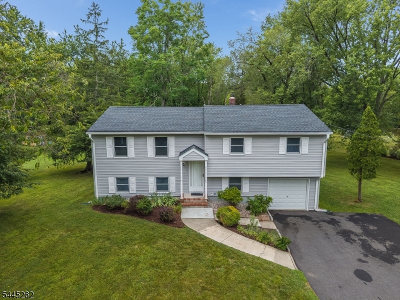Welcome to 1065 Papen Rd in Bridgewater, a well kept bi-level home offering space, flexibility, and a wonderful opportunity to make it your own. Built in 1963 and lovingly owned by the same owners for the last 46 years, this 4 bedroom, 1.5 bath home features hardwood floors throughout, generous room sizes, and a practical layout designed for comfortable everyday living. The main level includes a bright living room, formal dining area, kitchen, full bath, and three bedrooms, including the primary bedroom. The ground level adds valuable living space with a large family room, fourth bedroom, half bath, utility area, and direct access to the oversized one car attached garage. Outside, enjoy an expansive driveway, rear patio, and a spacious 1.1 acre yard surrounded by mature trees and greenery. With solid bones, a functional floor plan, and room for personal updates, this Bridgewater home is ready for its next chapter.