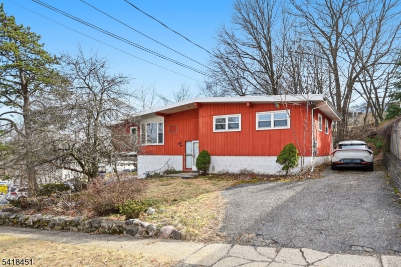 Back on Market! Move right into this beautifully refreshed home tucked away on a quiet street in Rockaway Boro!  The main level features bright, open living and dining spaces, and updated galley kitchen, a brand new hall bath, and three generous bedrooms.  Off the kitchen, the enclosed porch with all new windows fills the room with natural light.  The new finished walkout basement with a full bath, provides versatile extra living space, perfect for a home office, media room, or extra storage area.  Two driveways provide ample parking.  Ideally located near shopping, public transportation, and with an easy commute to NYC this one is not to be missed.