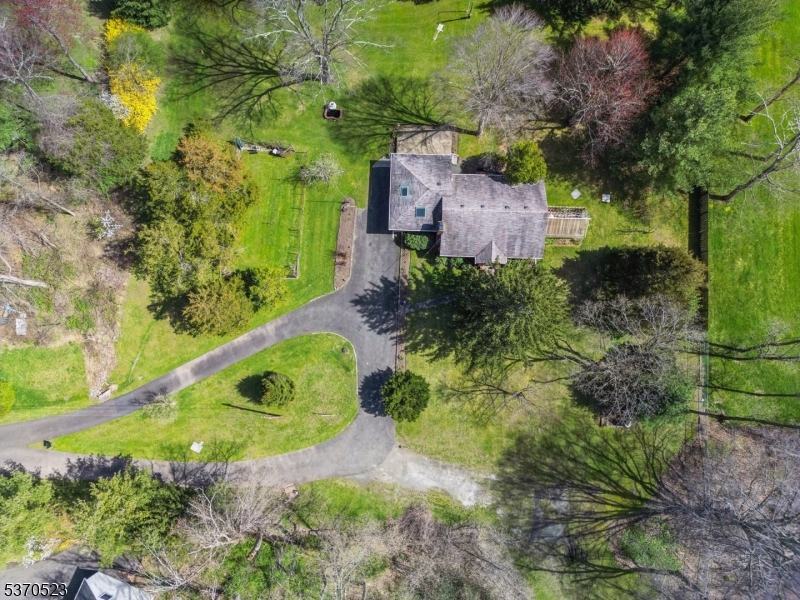 Fabulous opportunity to own a beautiful, level 7 acre parcel of land in thebucolic Green Village section of Chatham Township. Quiet, picturesque setting adjacent to Green Acres and minutes to hiking/biking trails and Loantaka recreation area, yet close to shopping and short drive to NJTransit.Ideal for small farm--live on 1 acre and farm 5 acres to benefit from farm assessed reduced property taxes! Also subdivision potential for new homes. Well built, all brick ranch on 1 acre with greatexpansion potential. Walk up attic convenient to add second floor! Plus 5.44 level, open land with treed borderbeing sold as a package. 50' wide partially paved roadway (Bassford Road) is approximately 1/2 acre andprovides access to 1 acre lot on left and 5.44 acre parcel straight ahead. Public water, sewer, and gas instreet. UST removed, DEP NFA letter on file.FEMA LOMA letter NOT flood zone.. Seller will accept offer with reasonable due diligence period. Land zoned single family residential. buyers MUST be accompanied to walkthe property, proceed with caution while walking property. Please park in driveway. DO NOT drive or park vehicles on land. Seller has deeded a right of way to #689 Shunpike. PROPERTY BEING SOLD STRICTLY AS IS in condition that it is viewed. The property consists of two parcels: lot 28 (house) and lot 25 (raw land). Sold as a pkg with MLS#4006843 (5.44 acres).DO NOT WALK PROPERTY WITHOUT PRIOR NOTICE/OK FROM PROPERTY Owner.