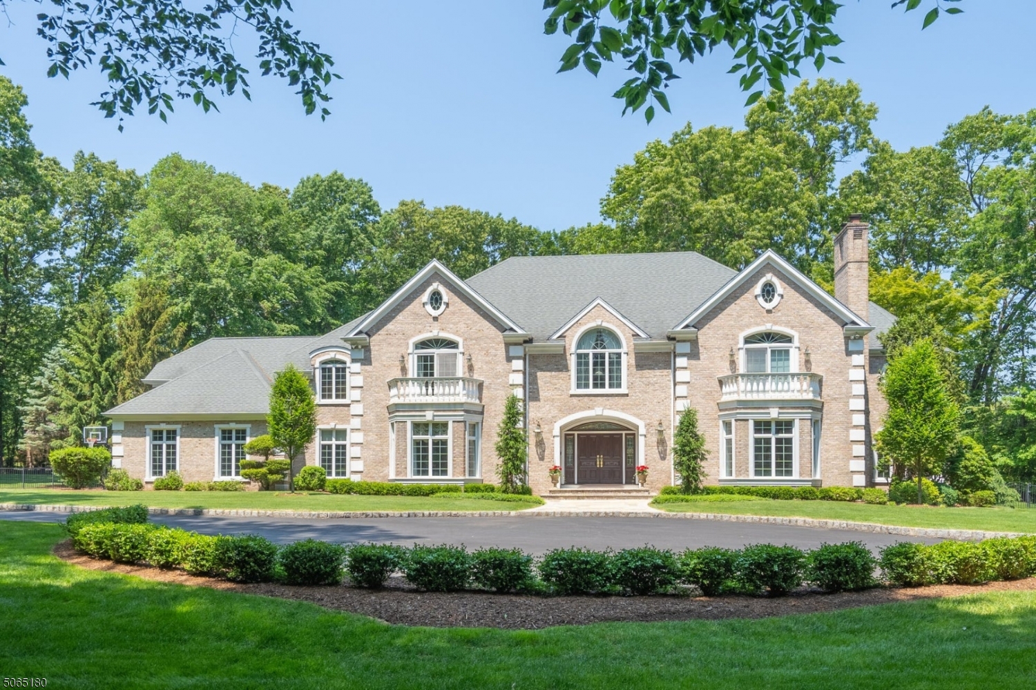 Over 8 Acres of privacy and exclusivity, welcome to 380 Crescent Drive, located just 25 miles from NYC. With over 8,000 square feet of living space, this home checks all of the boxes. This estate is set upon a private lake with direct access for ice skating, fishing, boating and more. Pavers surround the heated gunite pool and outdoor kitchen, perfect for both relaxing and entertaining. As you enter this all brick manor, you are welcomed by the grand natural light filled two story entryway. Each room more impressive than the next, the two story great room features oversized windows and breathtaking views. The open floor plan throughout this home offers total flexibility and multi use spaces. The gourmet eat in kitchen has some the highest end appliances and finishes you can buy.