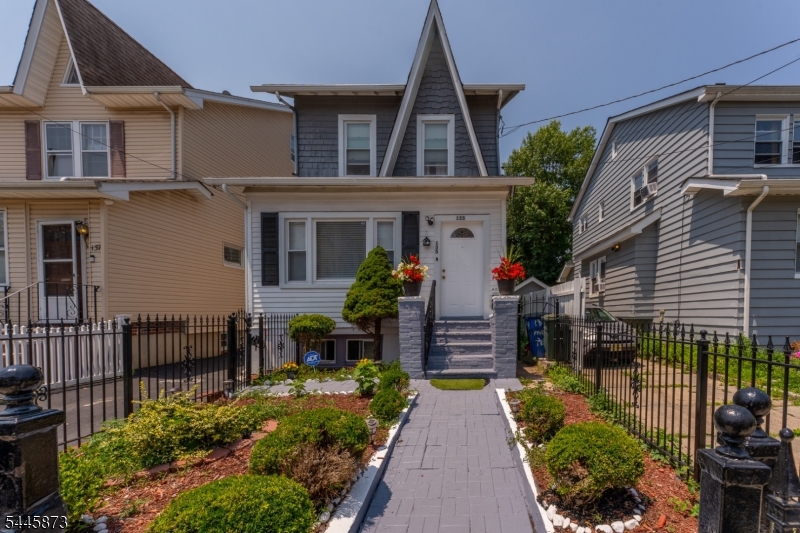 Welcome to this spacious and well-maintained single-family home offering exceptional flexibility and value in the heart of Irvington. This inviting residence features 3 generously sized bedrooms, 2.5 bathrooms, and a thoughtfully designed layout perfect for today's lifestyle. The first floor offers a bright living room with an additional office or flex space, a formal dining room ideal for entertaining, a spacious kitchen, convenient half bath, and first-floor laundry. Upstairs, the second level features two comfortable bedrooms and a full bathroom, while the finished third floor offers a private third bedroom perfect for a home office, guest room, or additional living space. The finished lower level includes a second kitchen, full bathroom, and separate laundry hookup, providing outstanding versatility for extended living arrangements, guests, recreation, or work-from-home needs. Outside, enjoy a long private driveway with ample off-street parking and a generous backyard ready for entertaining, gardening, or relaxing. Conveniently located near schools, parks, shopping, restaurants, houses of worship, major highways, and public transportation with easy access to Newark, the Garden State Parkway, I-78, and NYC commuting options. A fantastic opportunity for buyers seeking space, functionality, and long-term value. Schedule your private showing today!