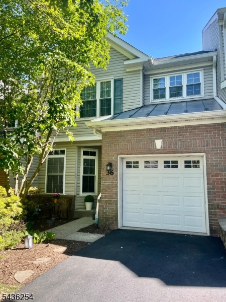 Welcome to this beautifully updated and impeccably maintained 2-BR, 3.1-BA townhouse located in the desirable Loft Farm community. This elegant home offers sophisticated living space across three finished levels, enhanced by hardwood flooring throughout and thoughtfully designed updates. The heart of the home is the stunning, gourmet kitchen, featuring Shaker-style birch cabinetry, quartz countertops, a custom tile backsplash, center island, newer appliances, and tile flooring. The main level also includes a formal dining room, an inviting living room with soaring ceilings, a wood-burning fireplace with custom mantel, and sliding doors leading to a private deck. Additional highlights include a stylishly updated powder room, laundry room, home office, and convenient garage access. The upper level features a luxurious primary suite complete with two walk-in closets and a spa-inspired ensuite bath. A generously sized second bedroom with its own full bath offers comfort and privacy. The fully finished lower level provides exceptional versatility with a spacious family room, private office with French doors, full BA, storage room, & utility room ideal for today's work-from-home lifestyle, guest accommodations, or recreation space. Combining refined finishes, generous living spaces, and a premier location within one of the area's most desirable communities, this exceptional townhouse presents a rare opportunity for upscale, low-maintenance living. HVAC 2025