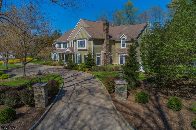This stunning 6-bedroom, 6-1/2 bath custom manor home enjoys an ideal location within one of Bergen's most desirable neighborhoods, Shadow Lake Estates. Meticulously updated and maintained, this home is undeniably unique in today's home market. 1st floor amenities include a recently completed Peter Salerno kitchen with a walk-in pantry, billiards room and pub, wood paneled home office, and a highly desirable first-floor bedroom, to name a few. A sweeping staircase whisks you to the second floor where you'll find 4 bedrooms and a home gym. The Master Suite wing, also on this floor, includes a sitting room with fireplace, inviting you to unwind before retiring. The backyard retreat that includes a salt water pool, spa and several patio areas. 4-car heated garage.