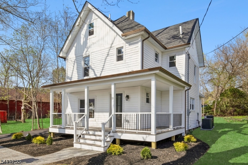 Fully renovated and move-in ready, this charming 3-bedroom home blends classic character with modern finishes throughout. The bright, inviting interior features a beautifully updated eat-in kitchen with shaker cabinetry, quartz countertops, stainless steel appliances, and warm wood accents.A flexible bonus room with its own powder room and backyard access is perfect for a home office, mudroom, or additional living space. Upstairs offers well-sized bedrooms, an updated hall bath, and a private primary suite with a modern en-suite bath. The finished basement provides valuable additional living space, bringing the home to approximately 2,000 sq ft.Situated on an oversized lot, the property features a wraparound covered front porch, long driveway, detached garage, patio, and a spacious backyard ideal for relaxing or entertaining. Conveniently located on a quiet street just minutes from local shops, dining, Route 23, and NYC commuter options. Simply unpack and enjoy.