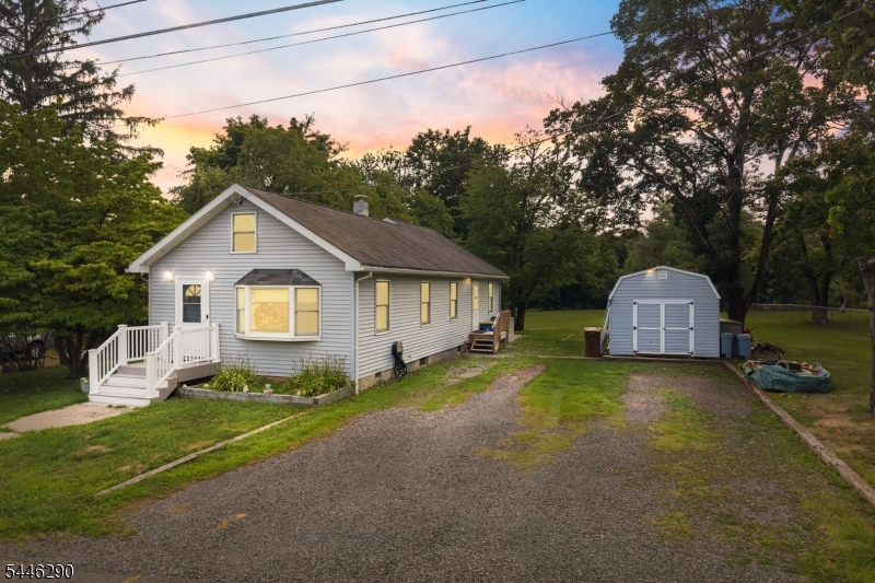 Exceptional 3-bedroom home with an office situated on nearly one acre in the desirable Bradley Gardens neighborhood of Bridgewater. This property offers tremendous potential for expansion, renovation, or new construction opportunities on generously proportioned grounds. The home features beautiful hardwood floors throughout, complemented by vinyl siding. The full basement adds valuable storage and development space, with excellent headroom for finishing projects. Electric heated floors in the bathroom provide comfort and efficiency. Ceiling fans in two of the bedrooms and the living roomThe expansive lot accommodates a three-car width driveway and a detached 16x12 shed, ideal for workshop space or additional storage. Mature landscaping and peaceful surroundings enhance the property's appeal while the substantial acreage provides flexibility for future enhancements. Located in an established Bridgewater community, this property is perfect for buyers seeking space, potential, and opportunity. Whether you're looking to build your dream home, expand the current structure, or create a personal retreat, this lot provides the foundation for your vision. A unique offering with exceptional land value in a convenient location.