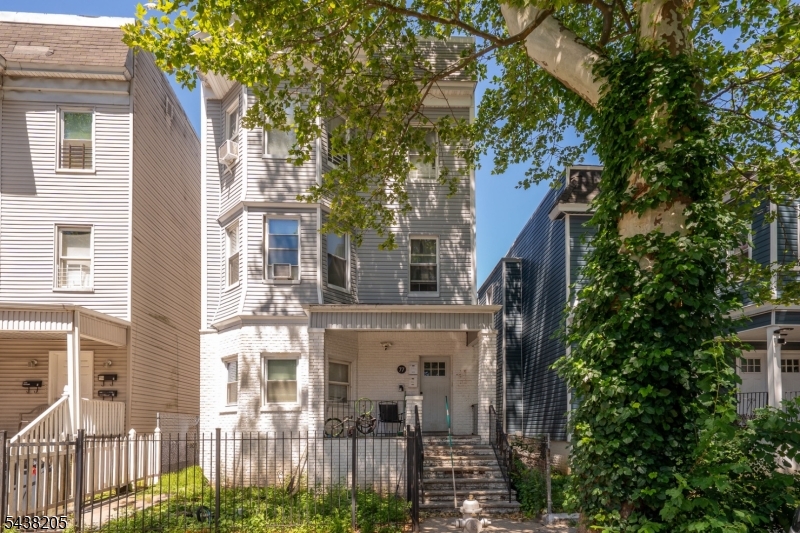 Welcome to 77 S 16th Street, a well-maintained three-family property nestled on a quiet, tree-lined street in East Orange. This income-producing gem offers a total of 9 bedrooms and 5 full bathrooms, making it an excellent opportunity for investors or owner-occupants seeking strong rental potential.The first-floor unit features 3 spacious bedrooms and 1 full bathroom, while the second and third units each offer 3 bedrooms and 2 full bathrooms, providing generous living space and attractive layouts for tenants. Each unit offers bright rooms, functional floor plans, and ample space for comfortable everyday living. Conveniently located near major highways, public transportation, shopping, dining, parks, and other local amenities, this property combines a peaceful residential setting with easy access to everything residents need. Whether you're looking to expand your investment portfolio or generate strong rental income, 77 S 16th Street presents an outstanding opportunity in a prime East Orange location. Don't miss your chance to own this versatile multi-family property with tremendous income potential!