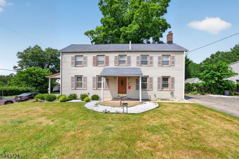 Boasting over 2,100 sq ft of living space, this charming center-hall Colonial perfectly blends timeless character with modern upgrades. From the moment you arrive, the exceptional curb appeal and manicured landscaping welcome you home. Inside, a fantastic floor plan connects the recently renovated spaces, making daily living and entertaining a breeze. The exterior offers ultimate peace of mind, highlighted by a newer roof installed in 2023. The home features three spacious bedrooms and additional den/flex room, including a luxurious primary retreat showcasing elevated ceiling heights that create an airy, grand atmosphere. Both the full and half bath have been completely reimagined with high-end finishes and premium fixtures. Transitioning outdoors, the beautifully manicured backyard offers a private oasis perfect for relaxing or entertaining. Location is everything, and this property delivers an incredible quality of life. Situated in close proximity to the downtown district of Pompton Lakes which is currently seeing a major redevelopment you are moments away from hometown favorite restaurants, local shops, and highly rated schools. Ideal for professionals, the home is close to NYC transportation, offering an easy commute into Manhattan in under an hour. This turnkey Colonial is ready for you to move right in.