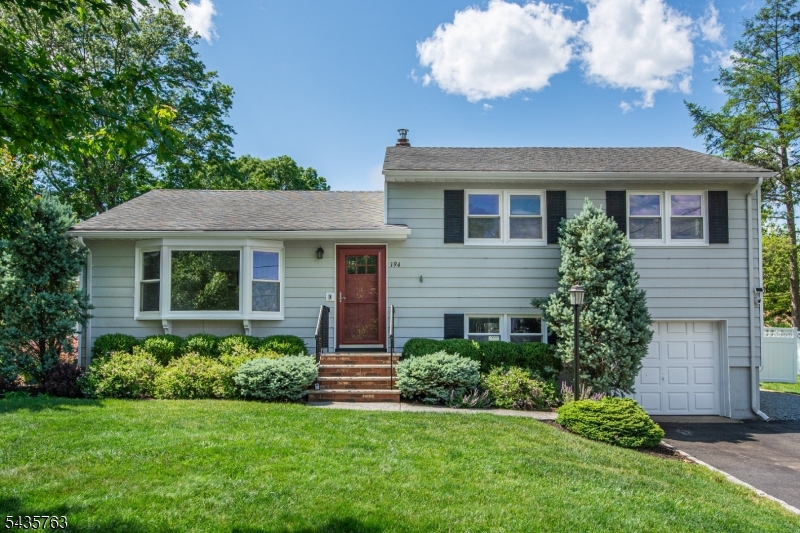 Offers due Wednesday, June 3 at 9 AM. Welcome home! The one you have been waiting for. Every inch of this property has been thoughtfully updated, starting with the gleaming, newly refinished hardwoods and a fresh, modern palette that carries you through the bright and airy layout. At the heart of the home is a stunning custom kitchen designed for the home chef, featuring crisp quartz countertops, a chic marble backsplash, stainless steel appliances, and recessed lighting that sets the perfect mood for hosting. The flow continues into a beautiful bonus sunroom the ideal spot for your morning coffee or a quiet afternoon read. Downstairs, the finished basement offers that essential extra living space for a media room, home gym, or play area.The bedrooms are impressively spacious, providing true retreats at the end of the day. Enjoy peace of mind with newer windows, new front door, water heater, central air and furnace. Step outside to find your own private oasis. The fenced-in yard is framed by mature, lush landscaping, offering a sense of seclusion and charm. Whether you're hosting summer BBQs on the gorgeous bluestone patio or winding down by the built-in fire pit on a crisp evening, this outdoor space is built for making memories. From the curb appeal to the backyard retreats, this home is ready for you to simply move in and enjoy. The driveway is wide enough to accommodate 4 cars side by side plus a large attached garage. Nothing to do but unpack and move right in!