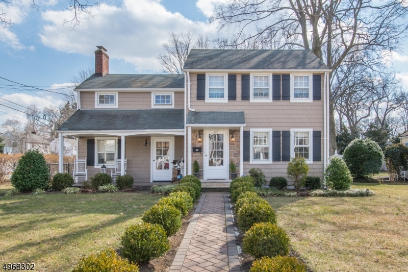Picture perfect home, located in desirable Pompton Plains, will not disappoint.There is so much character preserved in this 1940's Colonial yet offers all the conveniences to suit today's fussiest buyers. Kitchen boasts SS appls, granite counter tops and breakfast bar large enough for 5 and opens to cozy FR creating the perfect space to entertain. DR has loads of natural light,built in cupboards and custom wainscoting.LR wraps you in comfort with WB fireplace and custom shelving. Second floor has three bedrooms, main bath and walk up attic. Basement offers additional den, Laundry room,storage and access to the outside. From sitting on the front porch to entertaining in the back yard this house has it all. Run, don't walk you don't want to miss this one.