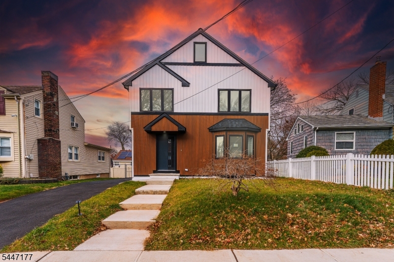 Welcome home to this stunning colonial in the desirable Sunnyside section of Linden! This home has been rebuilt from the foundation up, with all-new electrical, plumbing, a 2-zone HVAC system, appliances, roof, windows, and doors. Every major system has been replaced, so you can move in and truly just unpack your bags, no deferred maintenance to worry about. Situated in one of Linden's most sought-after and quiet residential neighborhoods, this spacious 4-bedroom, 3.5-bathroom home offers comfort and flexibility for today's lifestyle. The open-concept main level centers around a spacious kitchen with a large center island, flowing seamlessly into the living and dining areas, ideal for everyday living and entertaining. A large sliding door leads out to the deck and patio, extending your living space outdoors for gatherings, relaxation, or sunny afternoons. Each bathroom has been renovated with designer-like finishes, and every closet features custom built-ins for added storage. The finished basement adds versatile living space, perfect as a playroom, den, or media room, while the unfinished attic offers a blank canvas of flex space, ready to be finished for even more square footage down the road. A detached garage rounds out the property.Ideally located near shops, schools, and major highways and transportation, homes with this level of complete renovation don't come up often, this is a true turn-key opportunity from top to bottom.