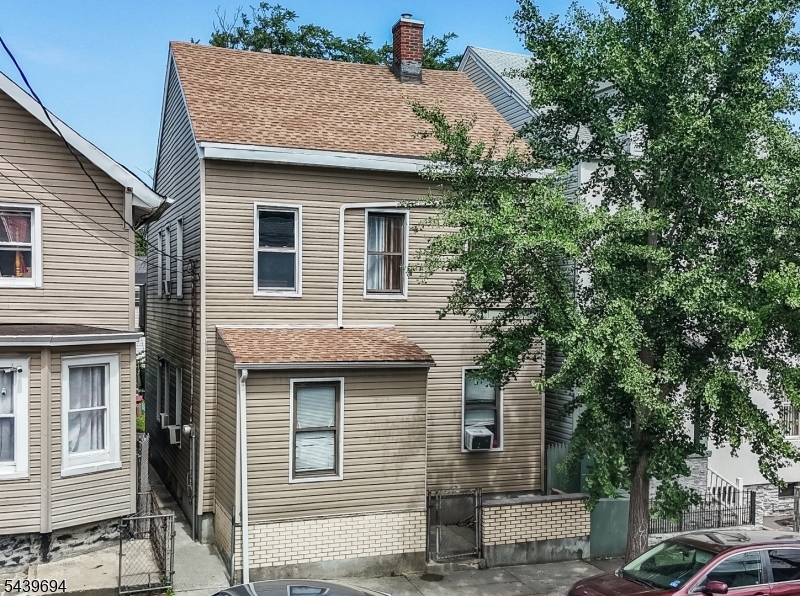 This well-maintained two-family home offers 4 bedrooms, 2 bathrooms, and 1,925 square feet of living space. Separate utilities for each unit make this an excellent opportunity for investors or owner-occupants seeking rental income from day one. Situated on a generous 25' x 100' lot, this home is conveniently located just minutes from shopping, dining, parks, and public transportation, including a direct bus line to the Port Authority. Enjoy easy access to New York City, approximately 22 miles away. Live in one unit and rent the other, or maximize its income-producing potential.