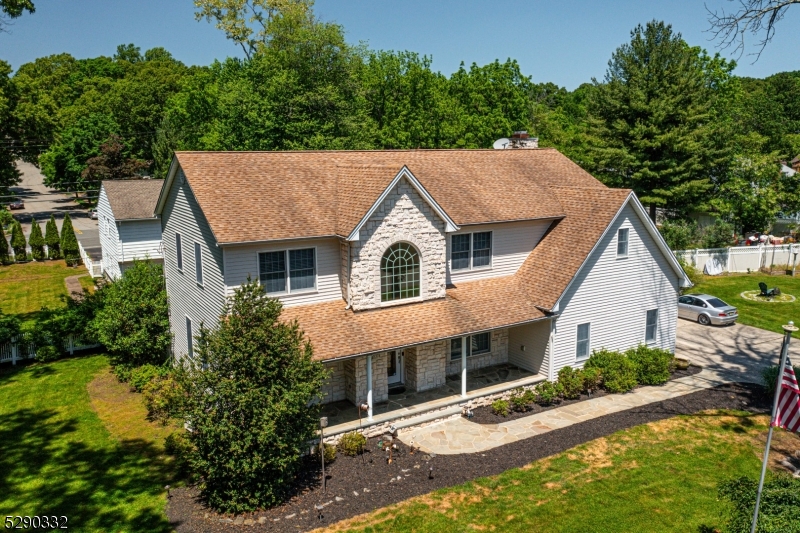 Custom built for original owners on oversized lot, this 5-bedroom,plus first floor office, 3 fireplaces,  3.5-bathroom colonial epitomizes luxury living in one of the area's most coveted communities. Step through the front door to this double story foyer, where soaring 9-foot ceilings, hardwood floors, and an abundance of natural light create an atmosphere of timeless sophistication.The heart of the home lies in the spacious kitchen, where granite countertops, Viking 6 burner plus griddle stove, sub zero refrigerator and wine fridge, plus plenty of  cabinetry await the culinary enthusiast. Skylights and recessed ceiling lights illuminate the space, while a breakfast bar provides the perfect spot for casual dining or mingling with guests. Entertain with ease in the adjacent family room, featuring a cozy fireplace and sliding glass doors that open onto a sprawling deck overlooking a yard with  plenty of room to play and relax. This  outdoor oasis is ideal for hosting summer barbecues or enjoying a quiet evening under the stars. THIS INCREDIBLE  fully finished basement, where a wet bar, a spacious recreation area, and a full bathroom offer endless possibilities for entertainment and relaxation.Situated in the highly desirable neighborhood of Parsippany, just steps from Park Rd Park, this home offers the perfect blend of tranquility & convenience. With its unparalleled craftsmanship, & unbeatable location, this is an opportunity not to be missed and this home is bused to school.