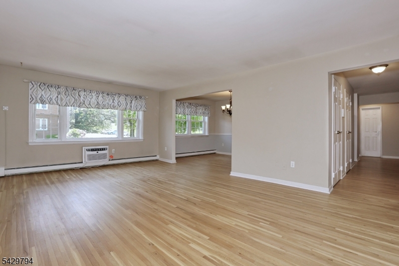 Nestled in a beautiful residential neighborhood near the Montclair border, Williamsburg South has much to offer.  Amenities include impeccably maintained grounds, a picnic area with tables and grills and a sparkling in ground pool.  Unit 2C is  the largest model in the complex at just over 1,000 square feet.  This end unit is filled with light in all rooms. Featuring a spacious living room, formal dining room with the potential for a 2nd bedroom and pristine kitchen with dining area.  The main bedroom is large enough to accommodate a king sized bed as well as having three closets.  There are double sinks in the bathroom,  a tub with shower, triple mirror medicine cabinet and linen closet.  You will also find two large entry closets as you enter the unit.  Laundry is located in the building as well as a private 4x7 storage unit. Maintenance includes heat/hot water and gas. Residents only pay electric, cable/WiFi.  Williamsburg South is located in close proximity to the GS parkway, Rt 3 and Rt 46 providing excellent access to NYC.  There is no smoking anywhere inside or outside the buildings. Rental allowed after two years of ownership and subject to a wait list.