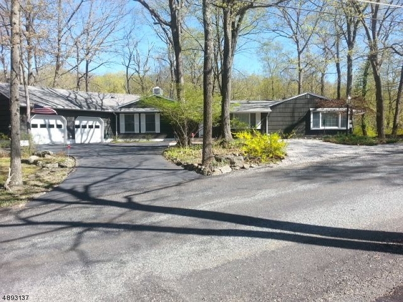 Custom Ranch nestled in Forest Lake community. .6 acres of treed surroundings, short distance to beach. Heated, oversized 2.5 car garage w/2 auto front & 1 auto side doors. 2 outside sheds, goldfish pond, private outside deck, multi zoned heating & A/C. Tons of storage space. New septic. Skylights and sun tubes throughout Close to shopping, recreation, routes 206 & 80.  IMMEDIATE POSSESSION.