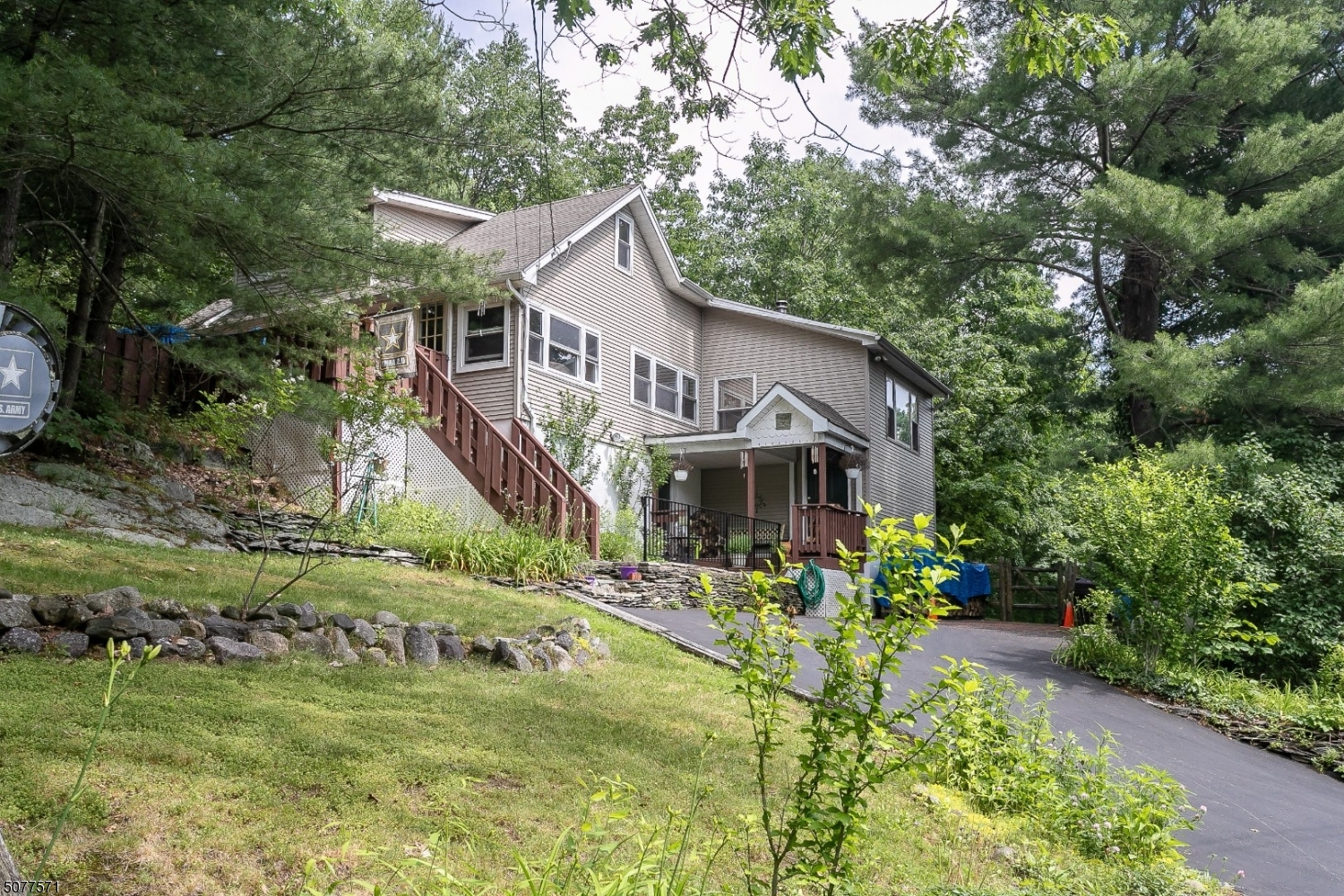 PERFECTLY TUCKED AWAY 2/3 BED CHALET COTTAGE WITH OPEN FLOOR PLAN! THIS ADORABLE HOME OFFERS UPDATED KITCHEN, S/S APPLIANCES, UPDATED BATHS, BEAUTIFUL WOOD WORK THROUGHOUT CATHEDRAL CEILINGS, PLENTY OF STORAGE. LARGE DECK FACING PRIVATE BACK YARD BACKING UP TO WOODS, LOTS OF MATURE LANDSCAPING. GENERATOR READY HOOKUP, ENJOY GREENWOOD LAKE AMENITIES W/ OPTIONAL MEMBERSHIP FEE.  MOTION-SENSING SECURITY LIGHTING AROUND THE HOME, ENTIRE FENCED YARD, GREAT FOR PETS, SEVERAL SKYLIGHTS LOCATED IN THE LIVING AREAS.