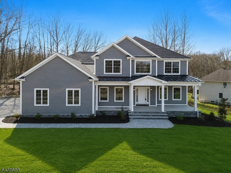 Welcome to this exceptional new construction Colonial, situated on a private cul-de-sac in desirable Andover Twp. Nestled on approximately 1.2 acres, this stunning home offers nearly 3,900 square feet of beautifully designed living space, blending timeless style w/ modern luxury. A charming covered front porch creates a warm welcome and sets the tone for the quality craftsmanship found throughout. Inside, soaring ceilings, oversized windows, and abundant natural light enhance the open concept layout. Featuring 4 spacious bedrooms, a 1st floor office, 4 full bathrooms, & 1 half bath, this home was thoughtfully designed for today's lifestyle. The gourmet kitchen boasts premium appliances, abundant cabinetry, a large center island, & seamless flow into the family room with a fireplace. A functional mudroom located off the 3 car garage adds convenience & organization. The primary suite offers a spa inspired bath and a stunning accent wall. Additional bedrooms feature custom built closets and ample space. Step outside to enjoy the rear patio overlooking the expansive backyard. The unfinished basement features impressive ceiling height & offers endless possibilities for future living space. Enjoy easy access to shopping, dining, golf courses, hiking trails, parks, & nearby lakes, while remaining within close proximity to major routes. Luxury finishes, premium materials, and quality craftsmanship make this exceptional property a rare opportunity.