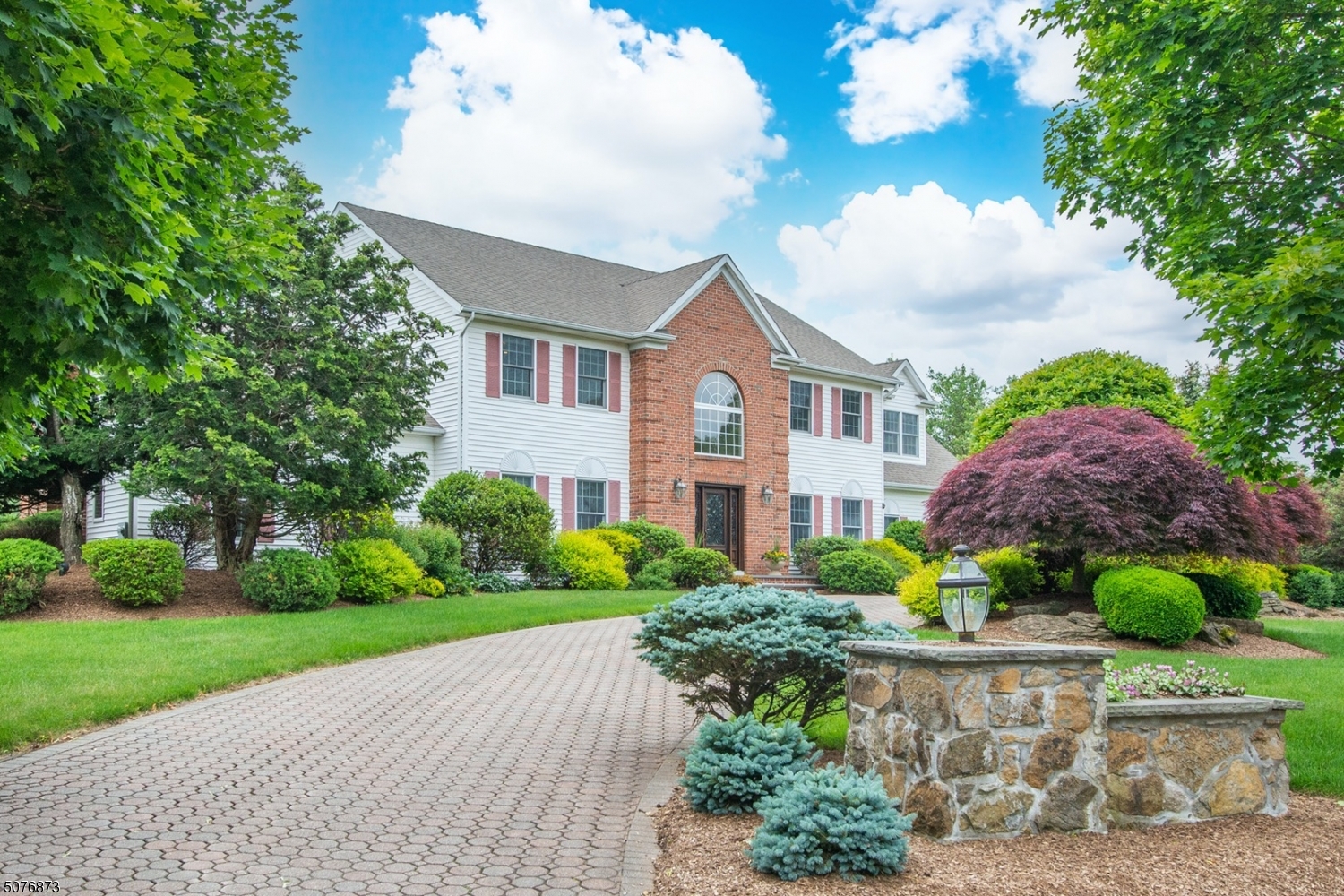 Nestled in one of Denville's most desirable neighborhoods, this home offers an upscale lifestyle on a quiet Cul-De-Sac. Elegant circular paver driveway welcome you to this Stately Colonial! Many high end features throughout. A grand home accented w/architectural details; high ceilings, wainscoting, porcelanosa tiles & moldings. Updated kitchen w/granite countertops, Wellborn cabinetry, & Miele & Wolf appliances. Formal Dining & Living Rooms. Striking 2 story Foyer & Great Room w/custom made gas fireplace. 1st floor suite w/sitting area & bath. Upstairs, the primary suite features a large bath, walk-in closet & sitting area. 3 more bdrms w/custom built in closets. Huge finished walkout bsmt w/recreation, soundproof home theater, cedar closet & wet bar or 2nd kitchen. Paver patio & landscaped backyard oasis.