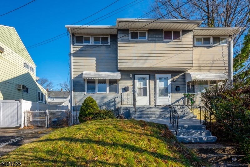 Location, Location, Location! This move in ready duplex is located only 3 blocks from train station and Downtown Rahway. Freshly painted duplex with a spacious Living room, dining room, kitchen and den on first floor. Full finished basement with family room, renovated full bath and laundry room. Second floor with 3 good size bedrooms and full bath. Parking for 3 cars and a good size backyard. Central Air and Heating.  Low taxes! Why pay rent when you can own?