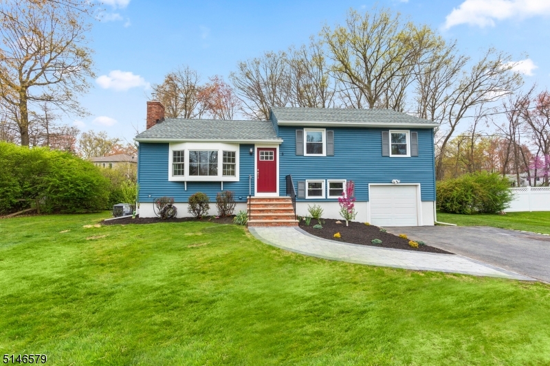 You'll be dazzled by this recently renovated 3 bedroom with 2 full bath split level home located in the Cedar Knolls section of Hanover Township. Highly desirable Hanover Township is known for low taxes & excellent schools. This fabulous spacious home with an open floor plan is ideal for entertaining & comfortable living. Attention to every detail with the recently completed high end renovation. Spacious kitchen boasting an abundance of cabinets, granite countertops, backsplash & self-closing drawers. Center Island with cabinets, drawers & microwave. Move into the dining room with wet bar & beverage cooler. Living room with bay window & wood burning fireplace. Master bedroom with additional 2 good sized bedrooms and full expanded/renovated bath complete with custom tiled tub/shower & double marble vanity. Lower level family room with luxury laminate & a full bathroom with shower. Step outside to the back yard from the family room or kitchen with a new paver patio &  large level lot. New windows, oak hardwood on main floor. Unfinished basement with recently installed french drains & sump pump just waiting to be finished. Oversized one car garage with plenty of room for storage Township has a beautiful town pool (additional fee), community center, and before/after school programs. Easy access to the Morris Plains NYC Midtown Direct Train. Short ride into downtown Morristown with restaurants, shops & theatre. Convenient to major highways