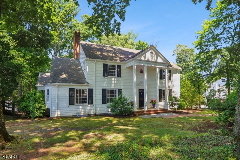 Custom built in 1960 by the owners, this charming center hall colonial is one of a kind.  It offers many unique features; spacious rooms with large windows, 4 fireplaces, an optional first floor master suite with a sitting room and full bath, a cozy library with numerous built ins, a screened in porch and a curved wall of windows in the dining room that open to a slate patio. The second floor has 4 large bedrooms and a captivating, surprise room off of the master bedroom. Located in the "Mansion Row" section of Chatham Borough, this home is deceiving large and very special!