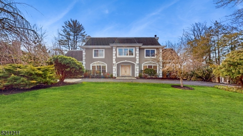 It's a stylish and welcoming home located in the coveted neighborhood of Short Hills. Entering the main floor, a high ceiling entry foyer with stunning Chandelier and staircases, formal living room with double-side fire place and wet bar; formal dining room with fire place; two powder rooms; family room/Library with beautiful wood shelf; masterful culinary kitchen with a breakfast area, command center, double sinks, high-end SS appliances(subzero fridge, Viking range, Bosch dishwasher, wine cooler, Deco double oven), granite counter top, crisp white cabinet; butler pantry; laundry room. The second level of living space includes master suite with two WIC, two full bath, siting area, large balcony facing the old short hills garden and green wood garden, enjoy the picturesque view everyday. Three additional spacious bedrooms, one en suite with full bath, the other two sharing a jack-and-jill bath and each have it's own WIC. The lower lever delivers a sprawling rec room, exercise room, one more bedroom, one full bath, utility room, storage room, and 3-car garage entrance, sliding door easy to walk out to the backyard. Generator for the whole house to ensure the fun never end. Entertaining and fulfill your life style, this is it! (the square footage is approximate, and includes the finished lower level.)