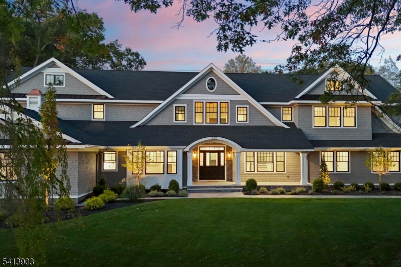 Builder incentives may be available for this new luxury Nantucket style home blended with refined modern touches in the sought after Hartshorn area of Short Hills. Set on a generous three quarter acre corner lot, this expansive 7 bedroom residence offers 6 full baths, 2 half baths, 2 offices and exceptional upgrades throughout. Highlights include a dramatic two story foyer, custom millwork, herringbone hardwood floors, California Closets and Restoration Hardware lighting. The gourmet kitchen features custom Medallion cabinetry, Caesarstone quartz countertops, Sub Zero refrigerator, Wolf appliances, 2 Miele dishwashers and a large center island opening to the family room. Two primary suites offer flexibility, including a first floor in law suite and an upstairs retreat with vaulted ceilings, exposed beams, dual walk in closets, radiant heated floors, soaking tub and glass shower. The finished walkout lower level is designed for everyday living and entertaining with a recreation room, gym, guest suite, wine cellar, lower pantry, art or hobby room and ample storage. Additional features include Nest thermostats, Ring security, Wi Fi boosters, whole house generator and heated 3 car garage with EV charging. Outside, enjoy professional landscaping, bluestone pathways, 2 driveways and approved plans for a heated Gunite pool and spa. Minutes to NYC trains, top rated Short Hills schools, downtown Millburn, nearby parks and the area?s premier shopping, dining and recreation.