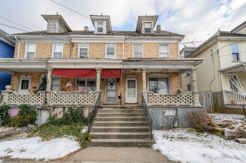 Opportunity is knocking! Spacious 3 Bed 1 Bath 1/2 Duplex in thriving Phillipsburg is bursting with possibilities, just in need of your personal touch! A great layout in a prime commuter location, this is an excellent fixer-upper to invest in, rent out, or make your very own. Charming covered rocking chair front porch welcomes you in to find a sizable living room and seperate formal dining room, along with an eat-in-kitchen with access to a versatile mud room. Upstairs, find 3 bedrooms and the main full bath. The primary bedroom has its own access to the walk-up attic. Full basement offers ample storage, laundry and utilities. Quaint outdoor area with patio and yard space, along with on-site parking for 2. Conveniently located just steps to the public transit bus line, schools, parks, shopping, dining and more. With your TLC, this could be the hidden gem you've been searching for! Come and see TODAY!