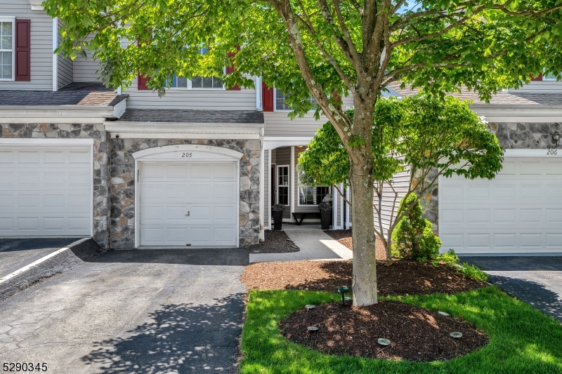 Enjoy your beautiful views from this nicely finished 3-bed, 2 1/2-bath townhome in Summit Falls! Enter through the covered porch into a gourmet kitchen with granite counters and updated with newer refrigerator, gas range and hood, and luxury vinyl plank flooring. Relax in the gracious living and dining area with a wood burning fireplace, wood floors, and glass sliding door to a maintenance free deck with retractable awning and one of the best views in the community. On the second level, the primary bedroom has a full ensuite bath and walk-in closet. The other two nicely sized bedrooms share a full bath. The finished basement has an extra room for storage or office, cedar closet, and walkout to an outdoor patio with views. Also included is a 2022 hot water heater, an attached 1-car garage, dedicated driveway, nearby guest parking, and use of a community pool. Assessment of $200/month until 2030, confirm fees with HOA. Monthly fees $465 beginning July 2024.