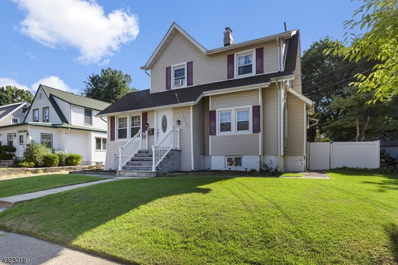 Large fully renovated four bedroom Colonial on an oversized flat lot. Full Finished Basement.  Ground floor as a living room with fireplace, formal dining room, renovated kitchen with breakfast bar. Full Bath has laundry hook up, den/office and a bonus room that could be a guest room or play room. Second floor has 3 bedrooms and a full bath. Third floor has another bedroom and a full bath. The basement is full with a finished rec. room, laundry area, half bath and storage. Large patio and covered deck overlooking the fenced backyard, perfect for entertaining and BBQs.  Large driveway with detached garage.  Newer heating system. Walk to NYC Bus Stop direct to Port Authority or George Washington Terminal.  Great Location in Bergenfield named one of the top places to live in the US.  Blue Ribbon Ranked.