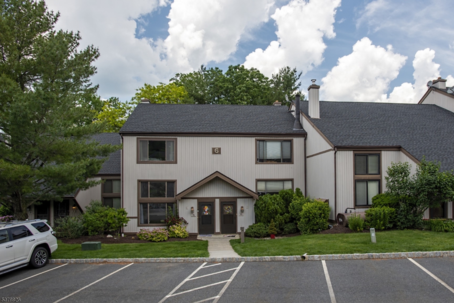 Welcome home! This unit can be very comfortably occupied as as 3 bedroom. You enter into an open layout featuring the dining and living room with high ceilings, and a beautiful wood burning fireplace. Home features a lrge eat in ktchen with updated cabinetry, SS appliances, and granite countertps. Ktchen is completed with a large custom built in, boasting a ton of additional cabinetry, matching granite, a work station, and more counter space. Lrge finished bsemnt with separate laundry room. The master bdrm, second bdrm, and den (can be used as 3rd bedroom), all found comfortably on the third floor. You can also enjoy the community clubhouse, and private in ground community pool! This development is FHA approved and conveniently located close to food shopping, shopping malls, and all major highways.