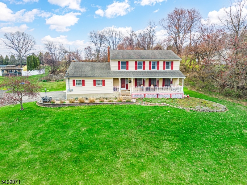 Welcome Home! This spacious 4-bedroom, 2.5-bath Colonial is set on 1.7 acres, featuring stunning front-facing mountain views. The main level offers an open layout connecting the kitchen and family room, complete with a fireplace and vaulted ceiling that fills the space with natural light. Sliders from the family room lead out to Trex decking, perfect for easy indoor-outdoor living. The kitchen features granite countertops, stainless steel appliances, and a convenient first-floor laundry/pantry combo, along with a half bath on the main level. Upstairs, you will find four bedrooms and two full baths. The home also includes a basement with a large open area and two additional finished rooms, offering plenty of potential to customize the space to your needs. Out back, enjoy an in-ground pool overlooking the mountains, along with a spacious yard that offers plenty of room for pets to roam and play. This home offers space, functionality, and endless potential!