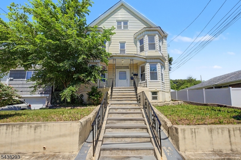 This spacious Belleville 2-family property with exclusive driveway and parking in back, on a quiet street, with 4 finished levels, all with separate entrances, makes it ideal for long-term rental ownership. 3700 sq ft + finished basement. The 1st floor unit offers a nicely sized living room and dining room, an eat-in kitchen, 2 LARGE bedrooms (350 sq ft & 200 sq ft), and a full bath. The 2nd floor unit includes 2 GENEROUSLY SIZED 300 sq ft bedrooms, 2 full baths, living room, dining room, and an eat-in kitchen. Finished walkout basement with a full bath, multiple rooms, laundry room, and a sump pump. Finished 3rd level with 2 bedrooms. 2nd level back porch. Successful property tax appeal effective 1/1/27 lowering property taxes from $19,384.09 to $14,661.74 based on 2026 tax rate. 2027 Belleville tax rate released on 7/1/26, which will confirm the exact amount effective 1/1/27. Ready for immediate occupancy. Qualifies for Provident Bank's 5% down payment loan with no PMI at a 5.75% interest rate & No income limit! 0.3 mile walk (about 5 min) from Belleville Elementary School 8 & 3. 0.4 mile walk (about 9 min) from Belleville Middle School. 1 min walk from Belleville Buccaneers Municipal Sports Field. 0.1 mile walk (about 2 min) from Union Ave at Holmes St local 74 bus stop. 0.5 mile walk (about 10 min) from Union Ave at Belleville Ave NJ Transit 109 bus stop going directly to NYC Port Authority Bus Terminal. Walking distance to restaurants on Washington and Belleville Ave.